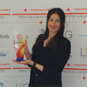 Amy Mckenna, Academy Director accepting an ward for training academy of the year